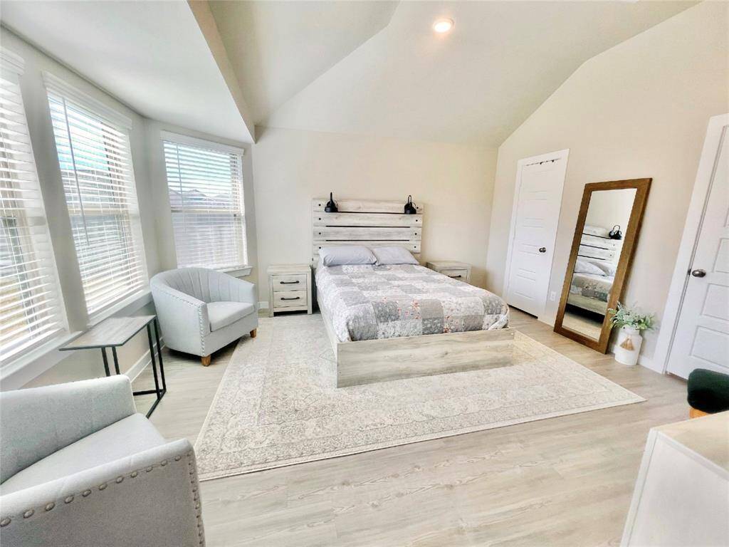 The primary suite as you enter from the living area. This is a nice peaceful retreat. A large walk-in closet is located in here as well.