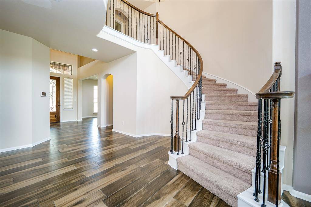 Lush carpeting and the visual beauty of the builder's signature wrought iron staircase, ensures luxury and safety.
