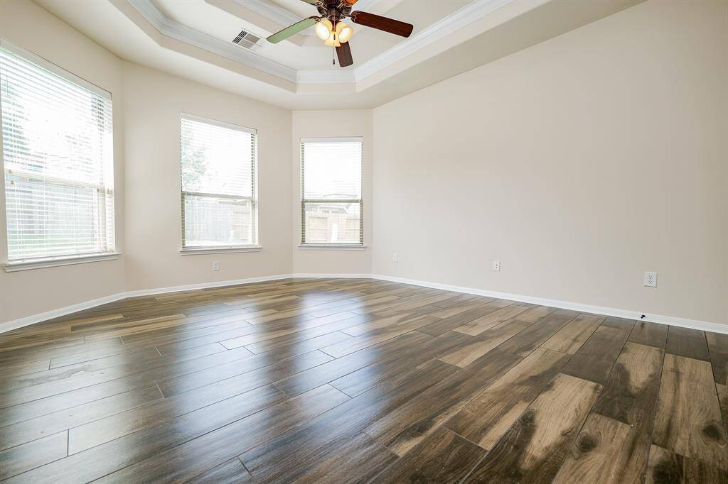 Huge bay windows line this wall in your luxurious primary suite on the 1st level.