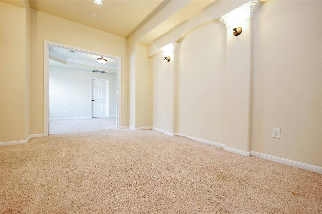 Gorgeous, art-deco-like column detail enhances your rich cinema room, which opens onto common 'game room' space on the 2nd level.