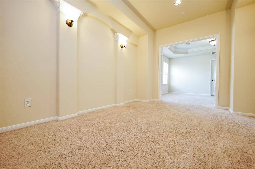 Golden tones in the cinema space open onto naturally lit areas on the 'game room' floor.
