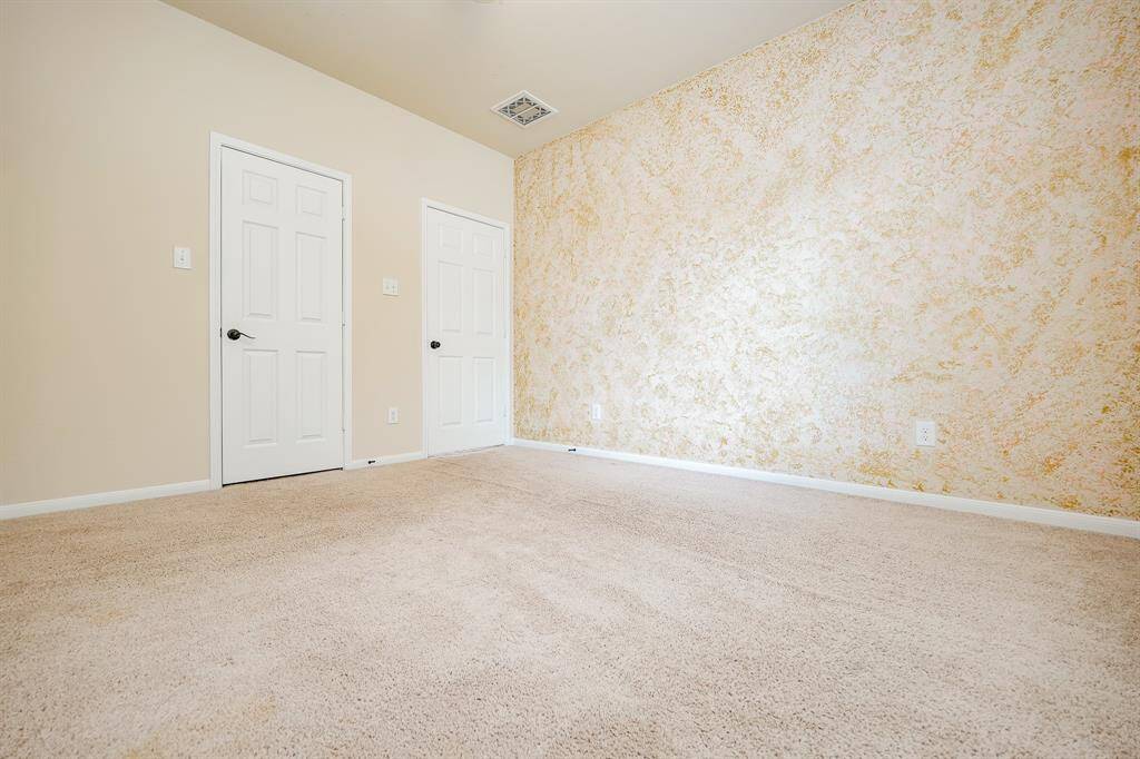 Isn't this accented wall in the primary suite a work of art, in itself?