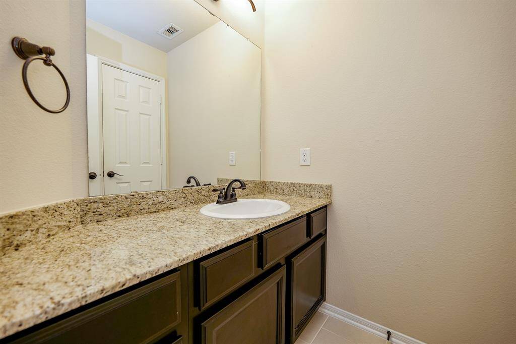 The half-bath ? is true to color themes in this glorious home!