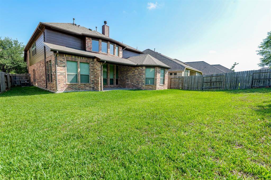 Beautifully impressive in its rear exterior view, this special residence welcomes a feast of outdoor entertaining!