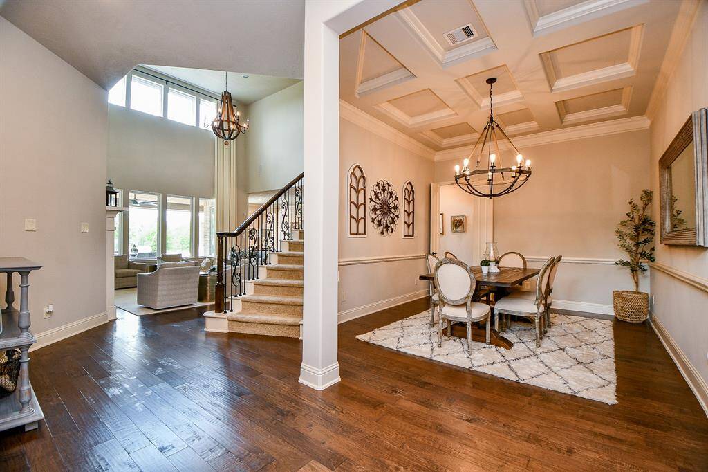 Designed for refined gatherings and memorable meals, the formal dining room offers a sophisticated space ideal for entertaining.