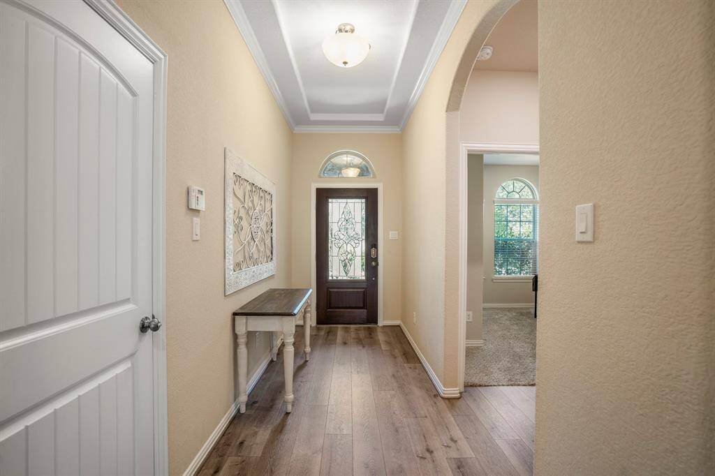 Another view of the beautiful front door from down the hall
