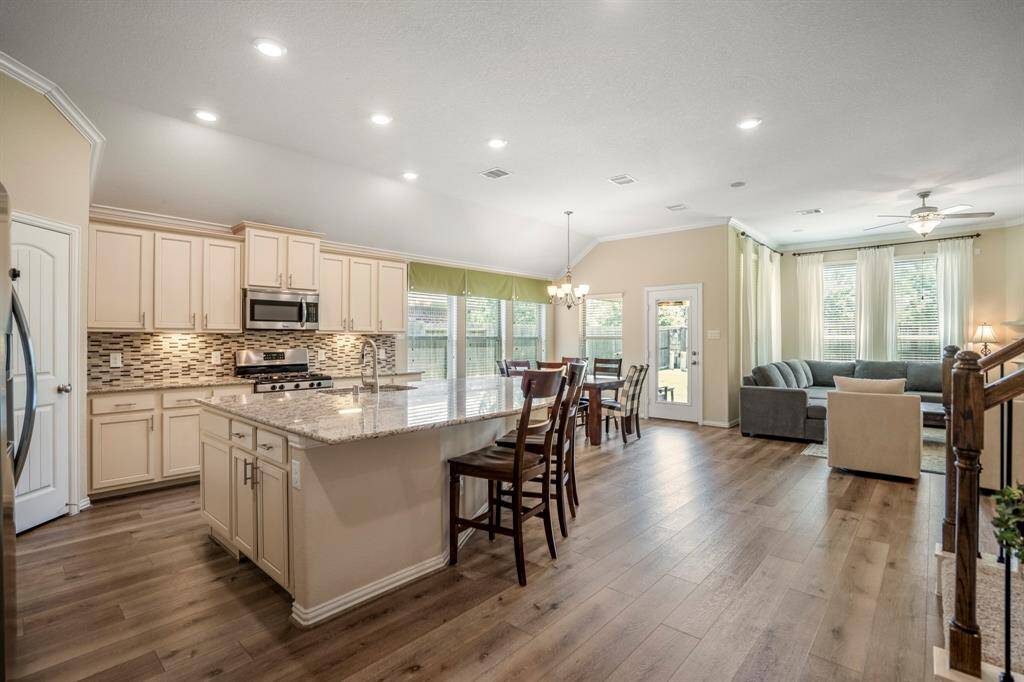 Open and inviting Kitchen with a large island and plenty of space for counter seating