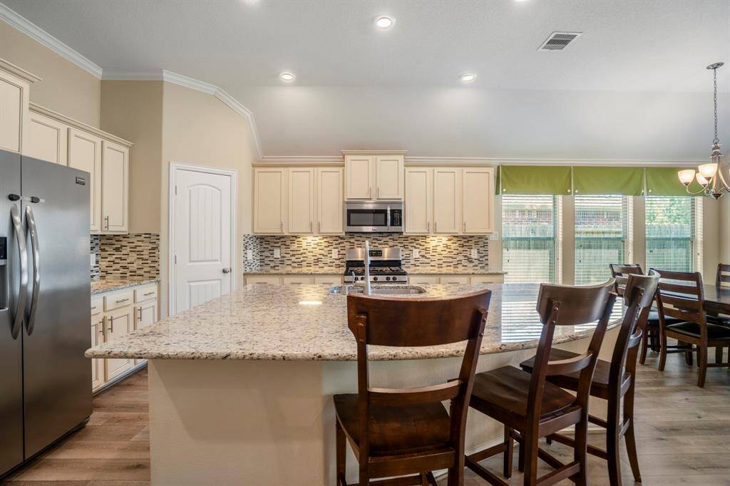Another view of the Kitchen and vaulted ceiling