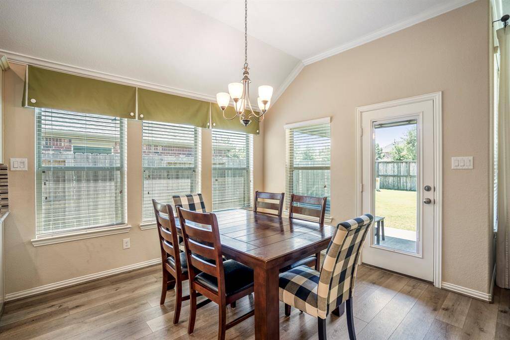 This Breakfast Room, on the back of the house, is connected to the Kitchen and Family Room and has access to the backyard