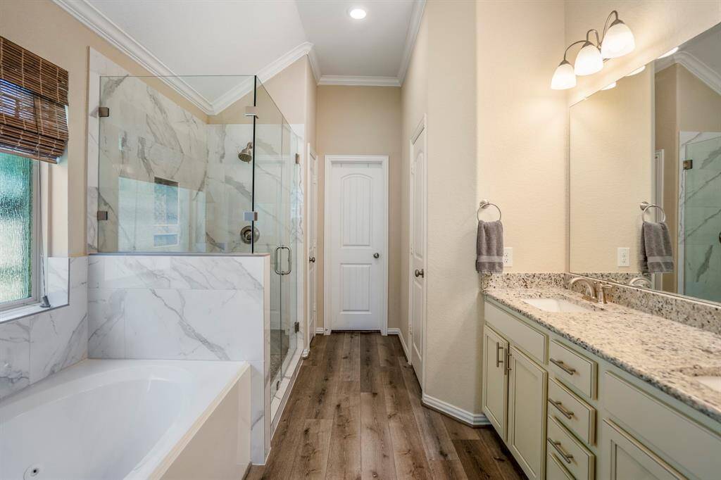 Primary Bath has been fully updated and features a soaking tub and a separate shower