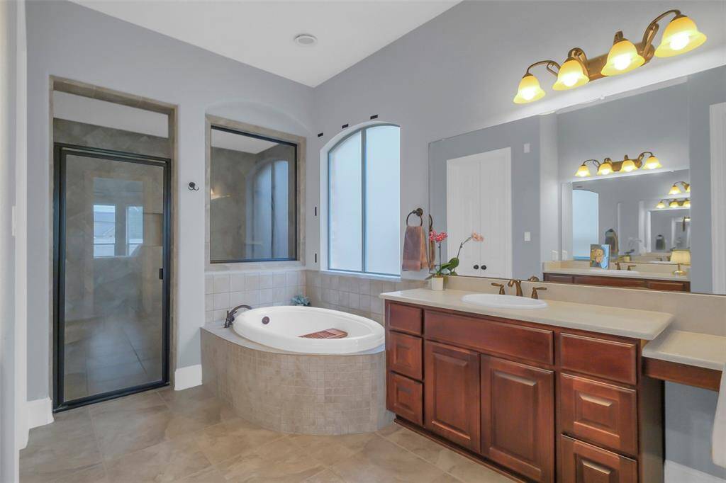 Separate vanities, garden tub and separate (large!) shower are features of this bathroom.