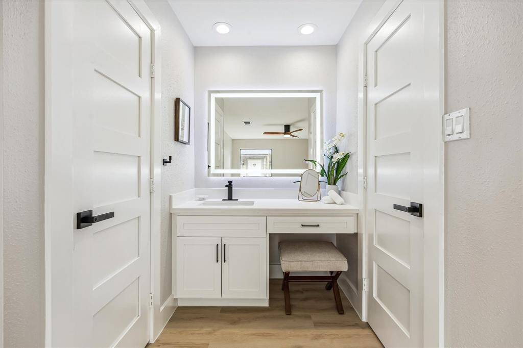 Vanity/sink off the primary bedroom.  Great space to primp.  To the left is the shower/toilet and to the right is the walk-in closet.  Note the lighted mirror!