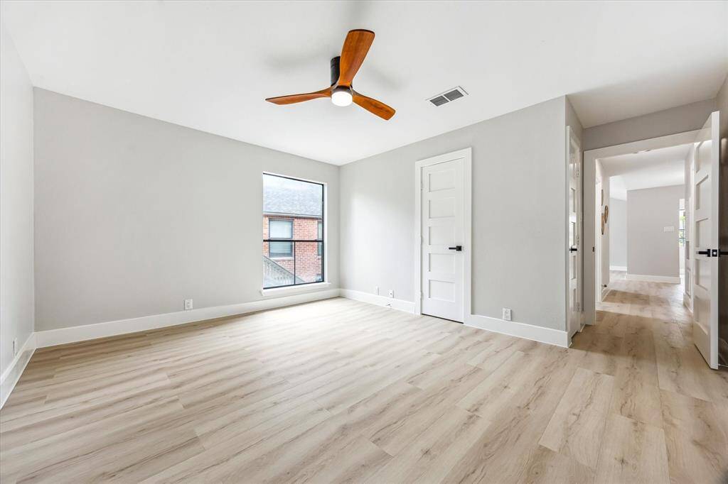 View of the primary bedroom.  Which offers a linen closet, a clothing closet and a third walk-in closet.