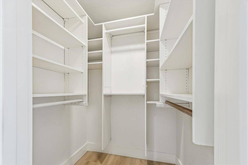Primary walk-in closet with custom storage system.  One of 3 closets in the primary.