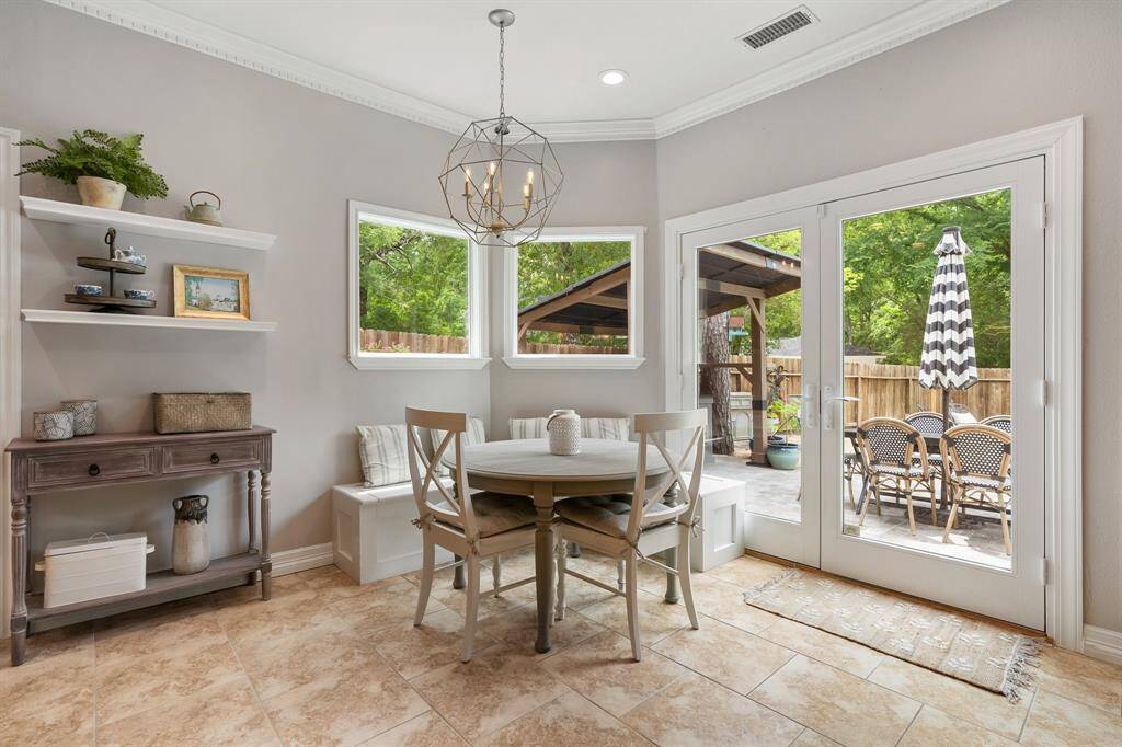 This casual dining area is perfect for anytime of day with the views to the backyard!