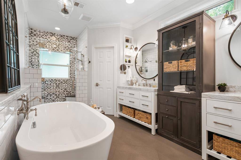 Oh, la, la!  Such a gorgeous primary bath!  Just let me slip into that tub and let all the concerns of the day float away!  And what a snazzy shower!