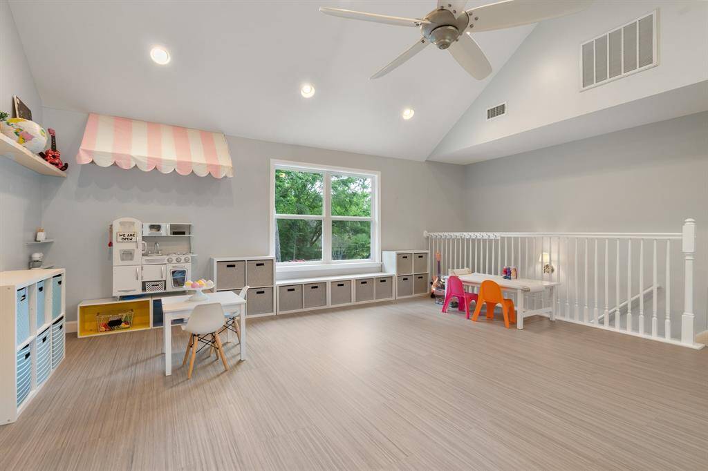 This room has 12 1/2 foot ceilings, and don't forget all the new windows throughout the home!  This is the back staircase you see that goes downstairs to just behind the kitchen.