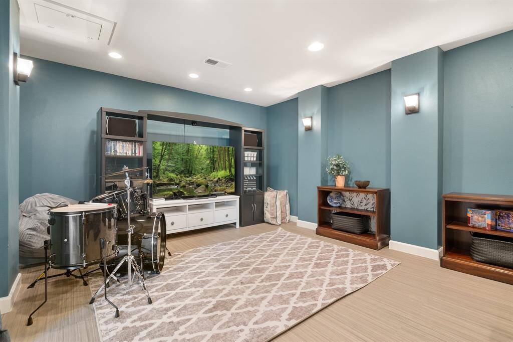 This media room is off of the game room.  A perfect place for movie night or in this case, playing the drums!
