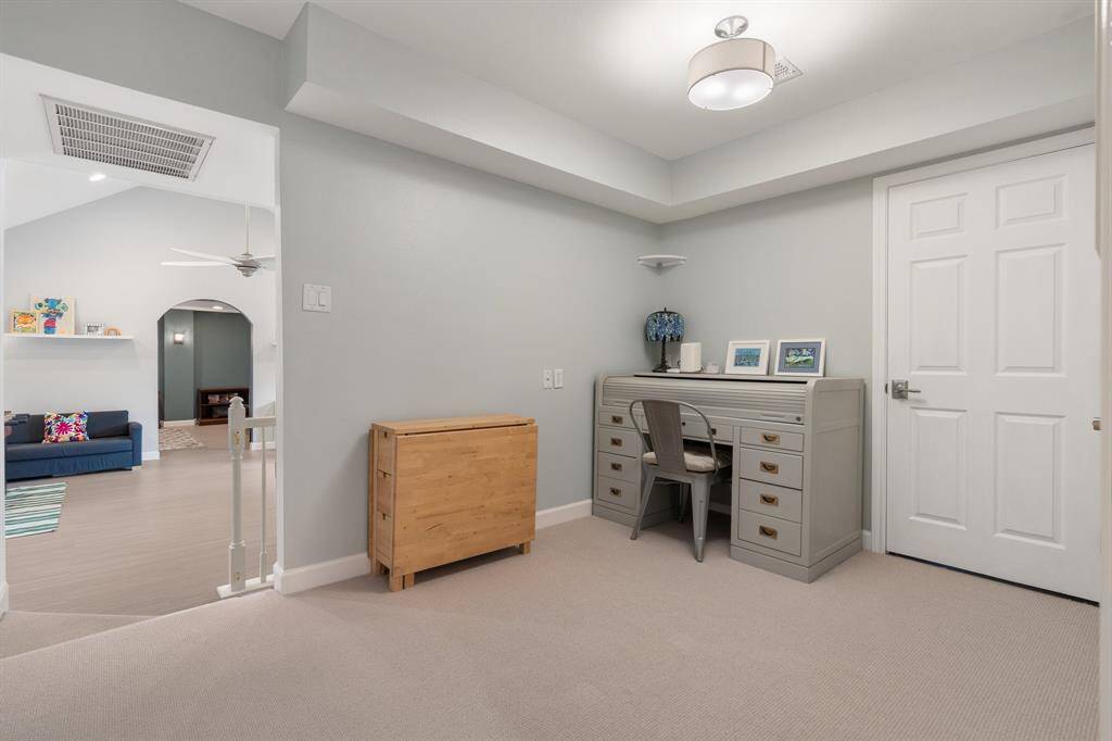 On the opposite side of the game room is this area that would be a perfect spot for a study area.  The door you see leads to a large storage room!  The carpet is Godfrey Hirst Wool.  No corners cut in this home!