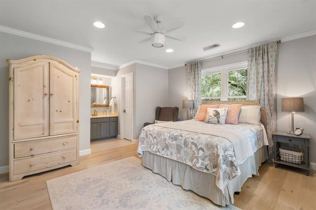The first of the secondary bedrooms upstairs and notice the size of the room!  Not only does it have the window you see in the picture, but a large window on the wall to the right!  So much light!  This room offers a walk in closet.  Floors in the upstairs bedrooms are Eco Timber White Oak oil finished wood.