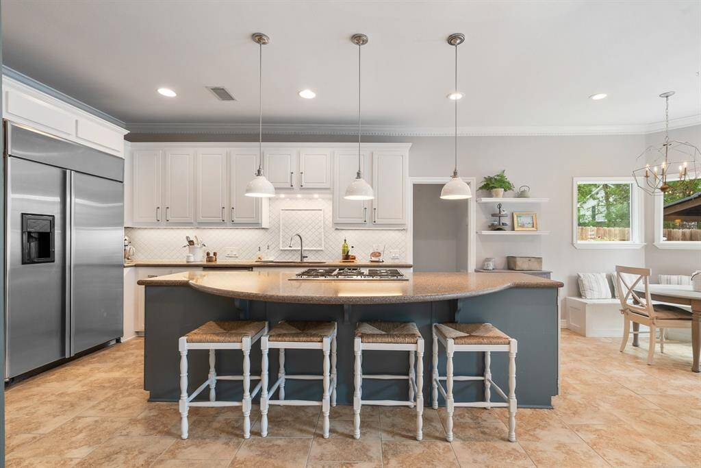 Let the chef in the kitchen stir up something good, and if you pull up a barstool perhaps you will be offered a taste!  Built-in fridge included!