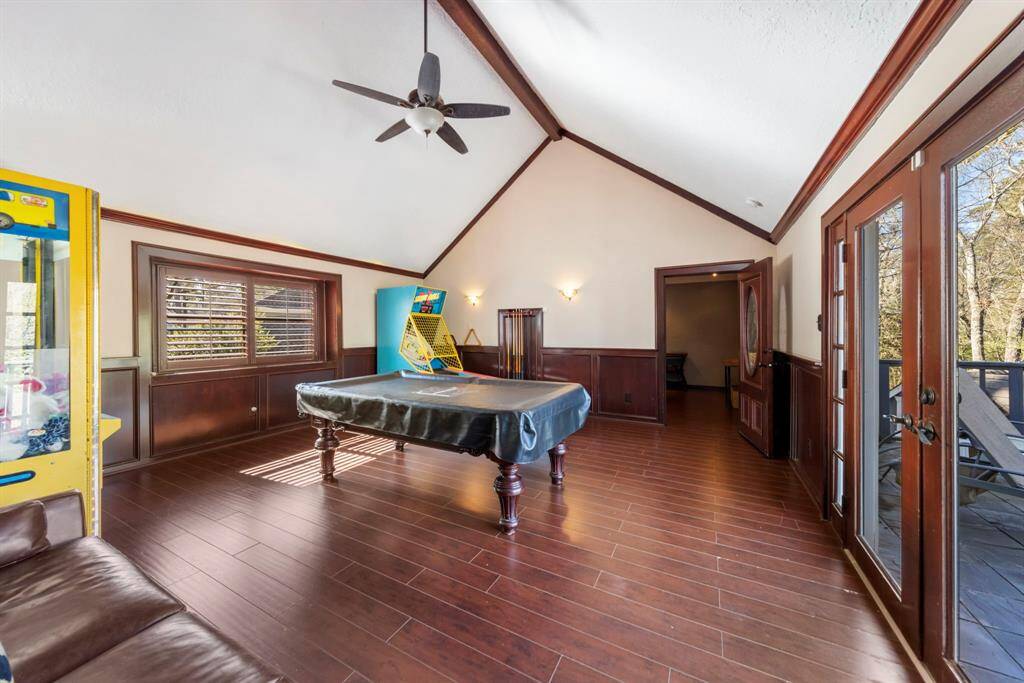 Thoughtfully located above the garage, the game room offers access to an outdoor balcony and a private media room.