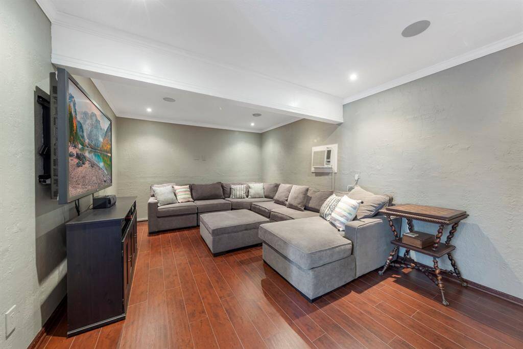 Tucked away from the rest of the home, the media room features a built-in sound system for the ultimate viewing experience.