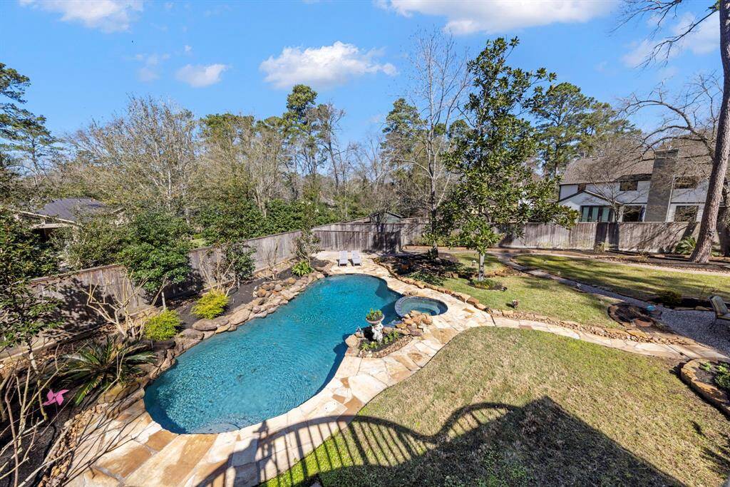 Enjoy a resort-style pool and spa, with plenty of lush green yard space—ideal for pets, children, and outdoor entertaining.