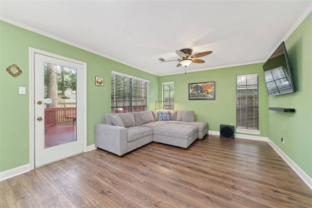 Second living room that leads to the shaded backyard.