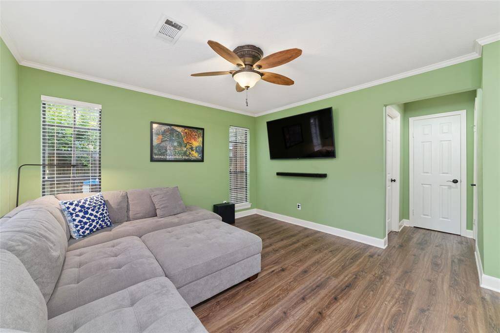 The hallway leads to the 1/2 bath, laundry room, linen closet, and 2-car garage.