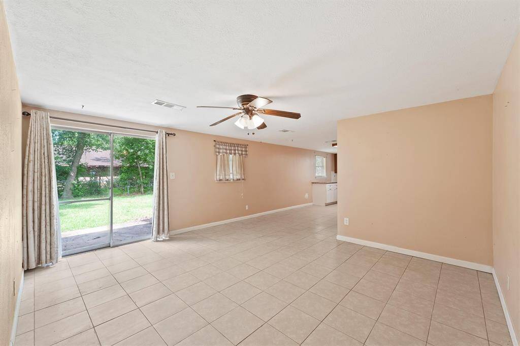 The home offers natural light with a view of the beautiful backyard.