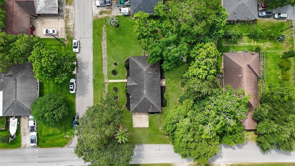 The home is situated on a corner lot with mature trees.