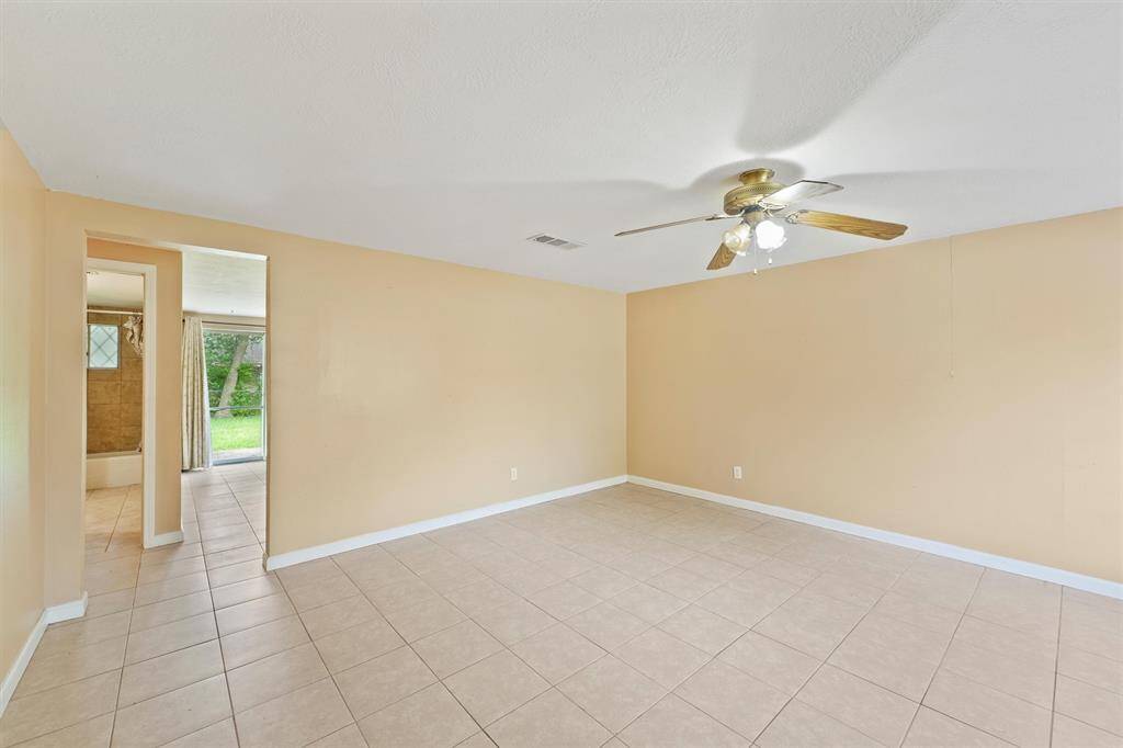 Upon entering into the home you are greeted by a spacious den area that can be used as a seating area or even remodeled in the future and opened to join the kitchen behind the wall.