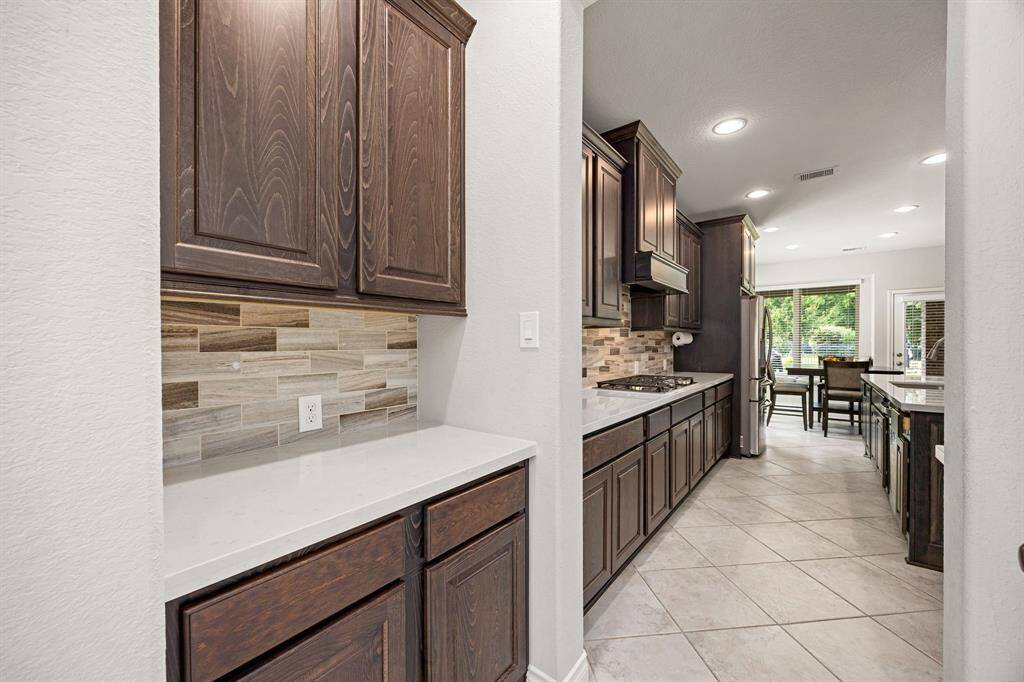 Butlers Pantry & Large Walk-In Pantry Just Off the Kitchen