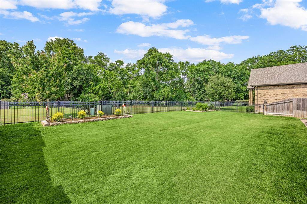 Back Yard Green Space With Planter Boxes With Landscaping