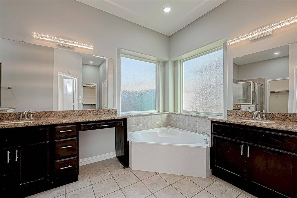 Experience luxury in this spacious bathroom!