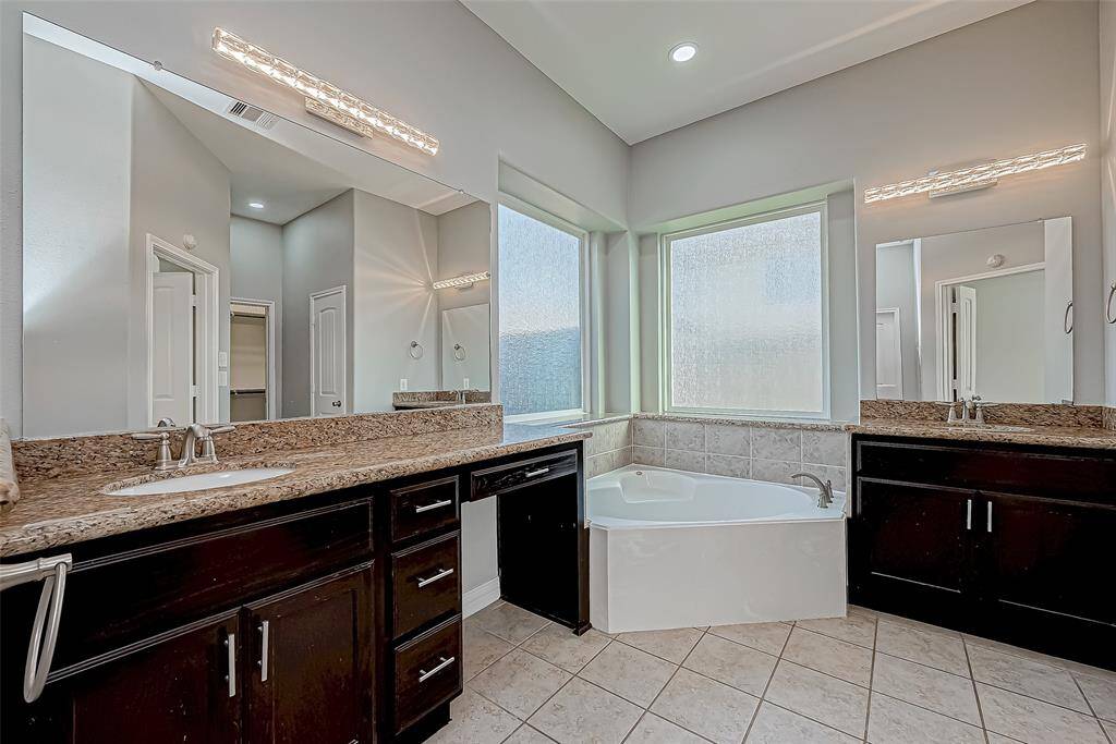 Complete with a stunning generous tub and stylish sink for ultimate relaxation after a long day!
