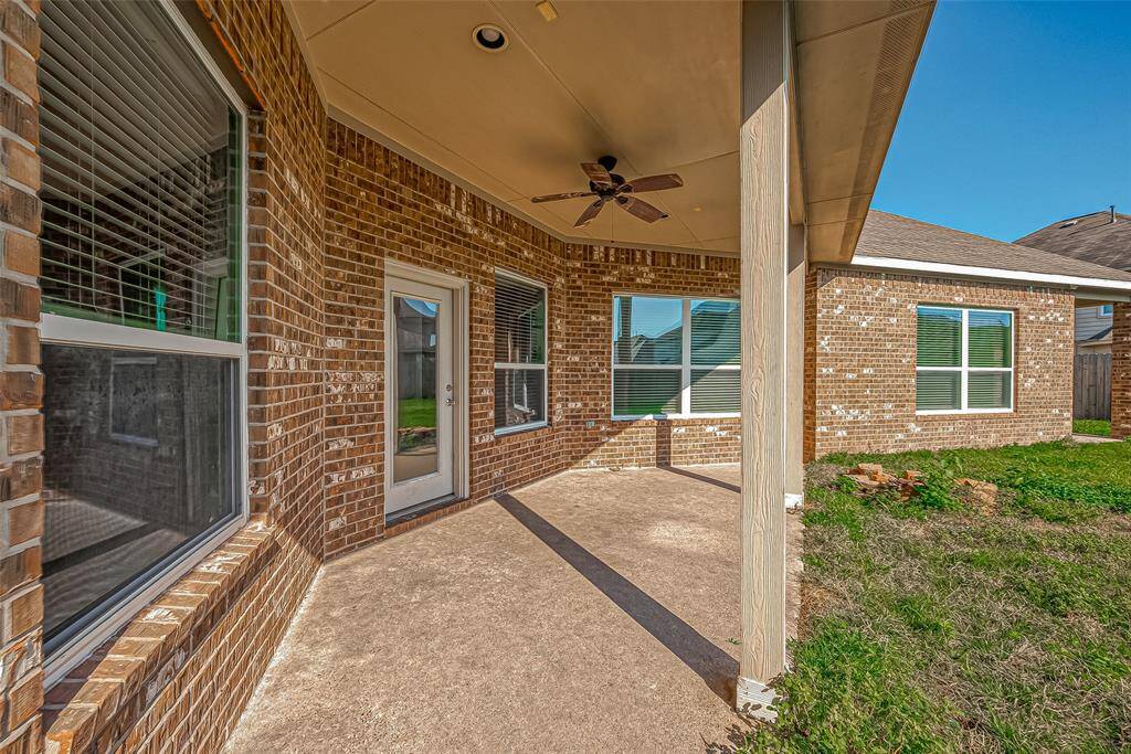 Cozy covered porch ideal for outdoor gatherings and leisurely afternoons with the family!