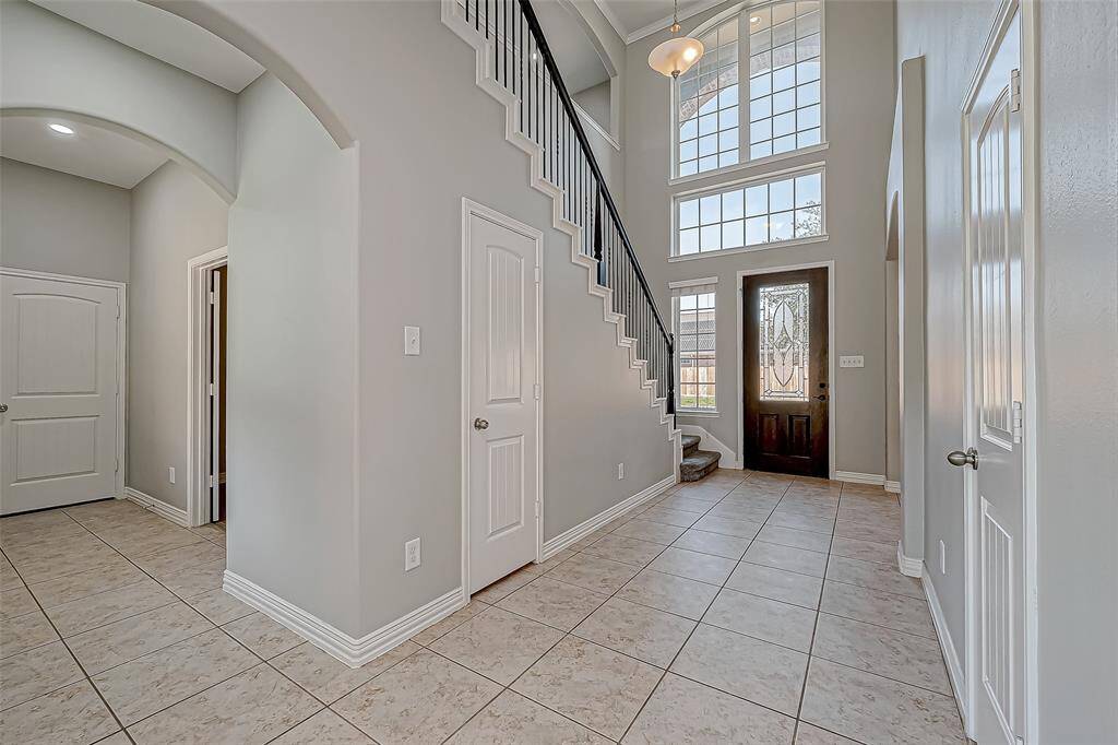 Welcome to your future! This beautiful foyer set the stage for a delightful living with your family.