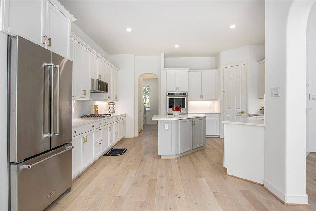 The brand new refrigerator can stay with the house and matches perfectly with all the other high end stainless steel appliances.