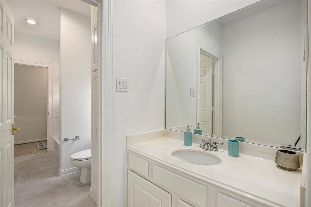 This is the upstairs jack and jill full bath. Access the shared toilet and bath/shower combo from two different bathrooms.