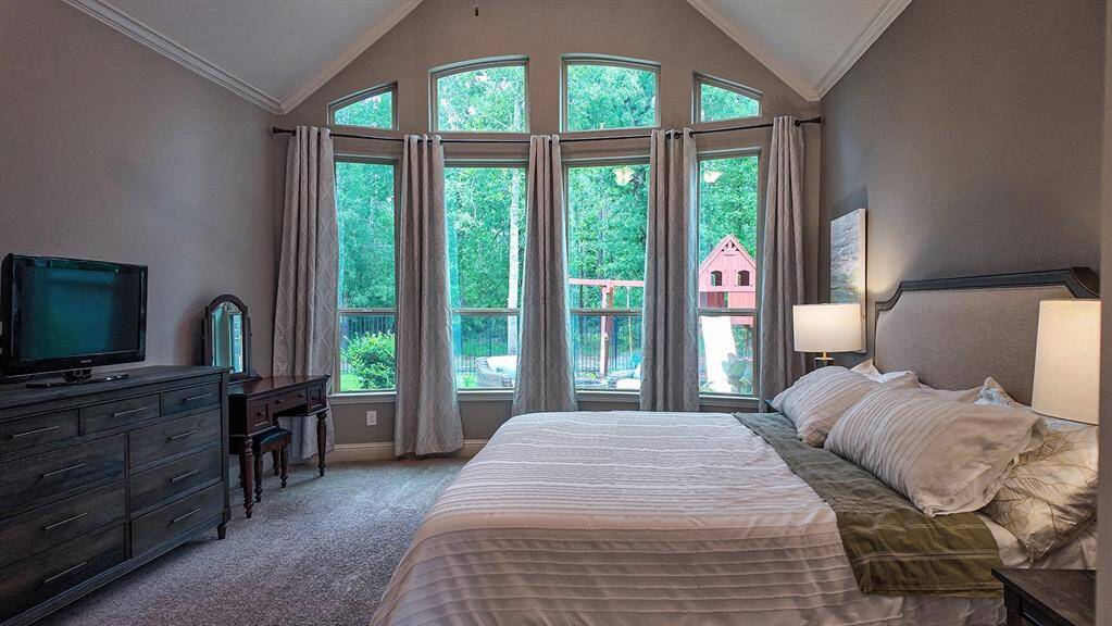Oversized primary bedroom enjoys sunrise views