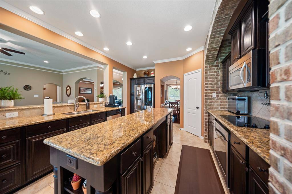 Abundant counter space and thoughtful layout make this kitchen as functional as it is attractive, ideal for hosting and day-to-day cooking alike.