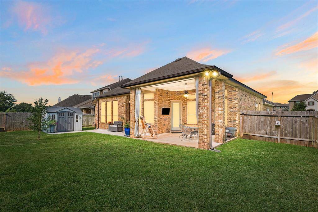 Sit back, relax and enjoy your gorgeous backyard under your large covered patio. Complete with outdoor fan and plenty of space for an outdoor kitchen or grilling station and outdoor seating. Your covered patio overlooks your huge backyard with plenty of green space for the kids and your furry friends to enjoy.