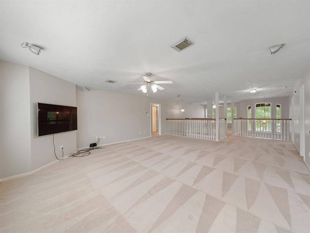 The game room is on both sides of the steps, making two separate areas, setting this space up for multi-use possibilities.