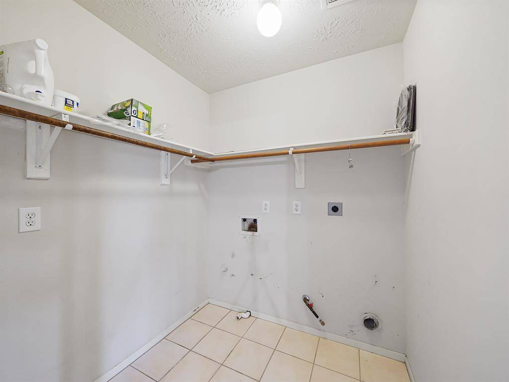 Laundry/utility room located upstairs.