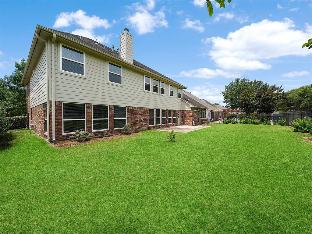 Spacious fenced in backyard.  Great space for outdoor activities - grilling, playing catch, or fetch with Fido.