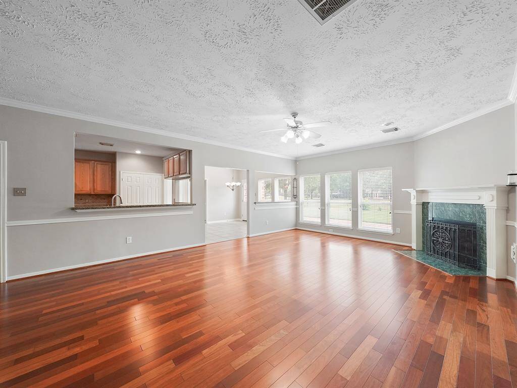 Large windows allow natural light to fill the space and provide views of the backyard.