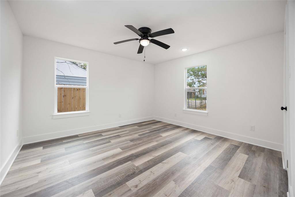Bright secondary bedroom with abundant natural light.