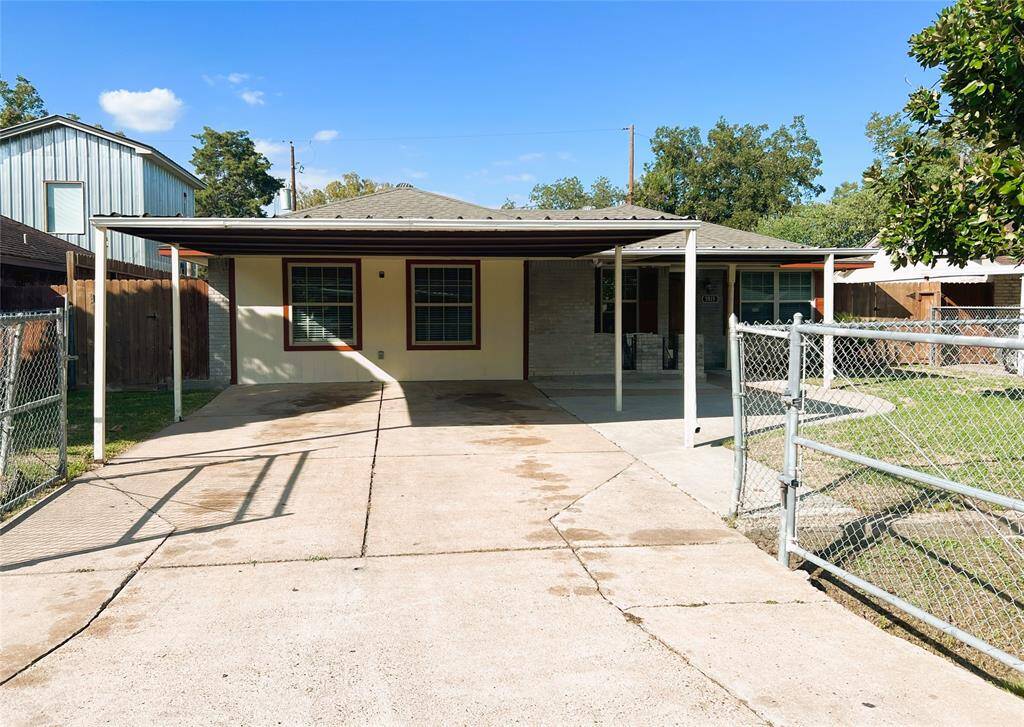 CARPORT AND GATED DRIVEWAY ENTRANCE